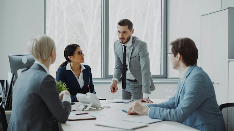 Colleagues meeting around a table
