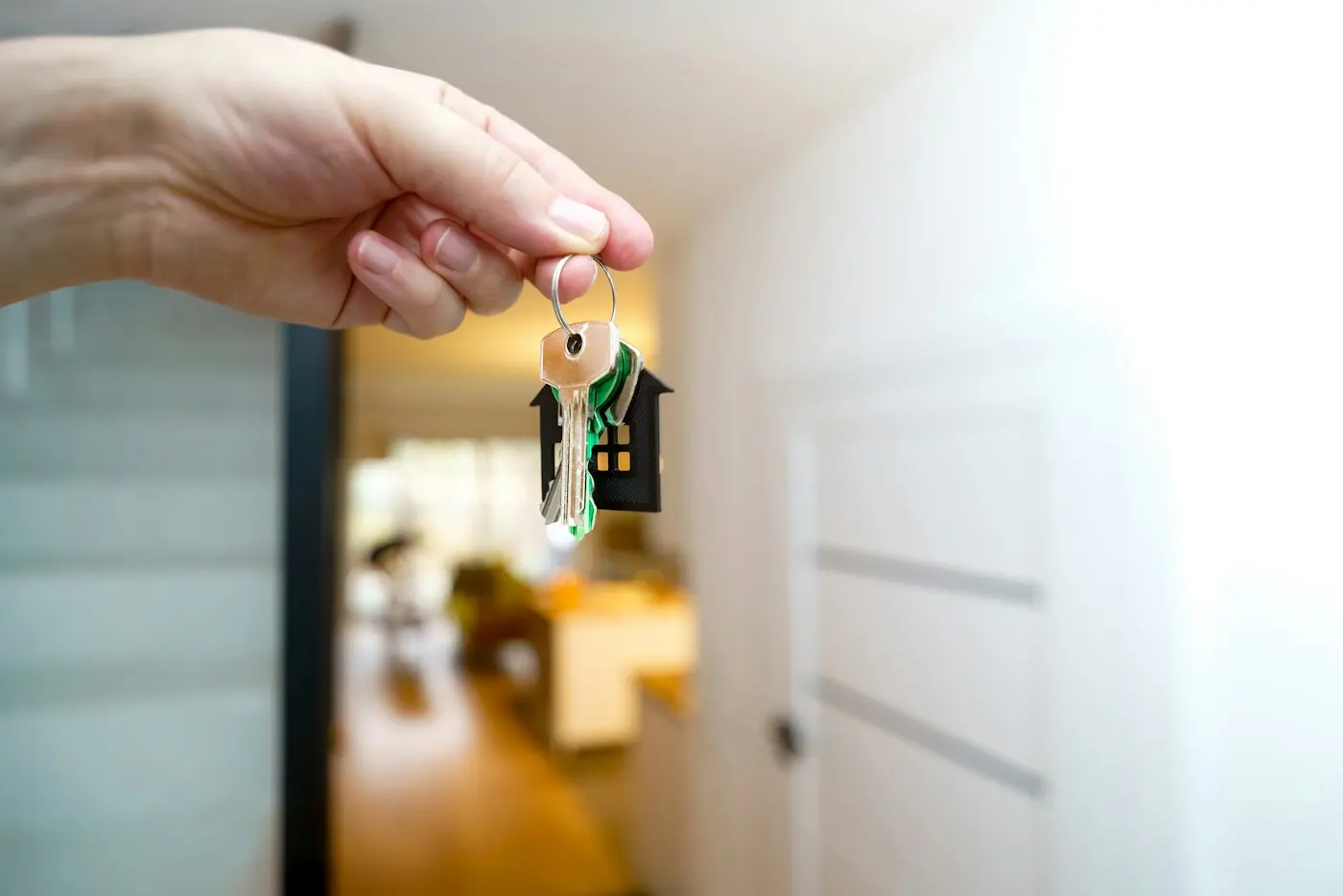 Holding house keys at the front door