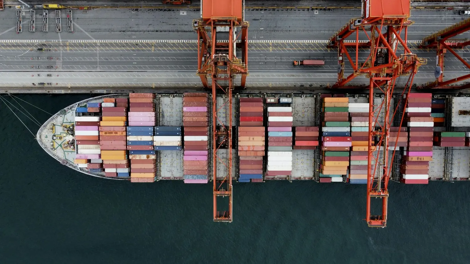 Container ship being loaded at a port