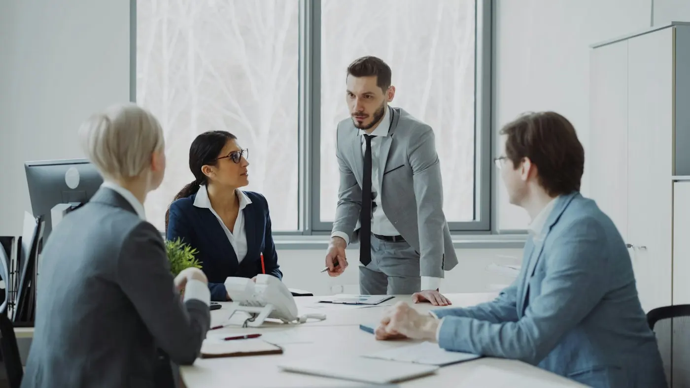 Colleagues meeting around a table
